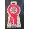 1 coccarda rosa “Bon Anniv Super Nana”.