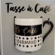 1 schwarz-goldene Kaffeetassen mit Text